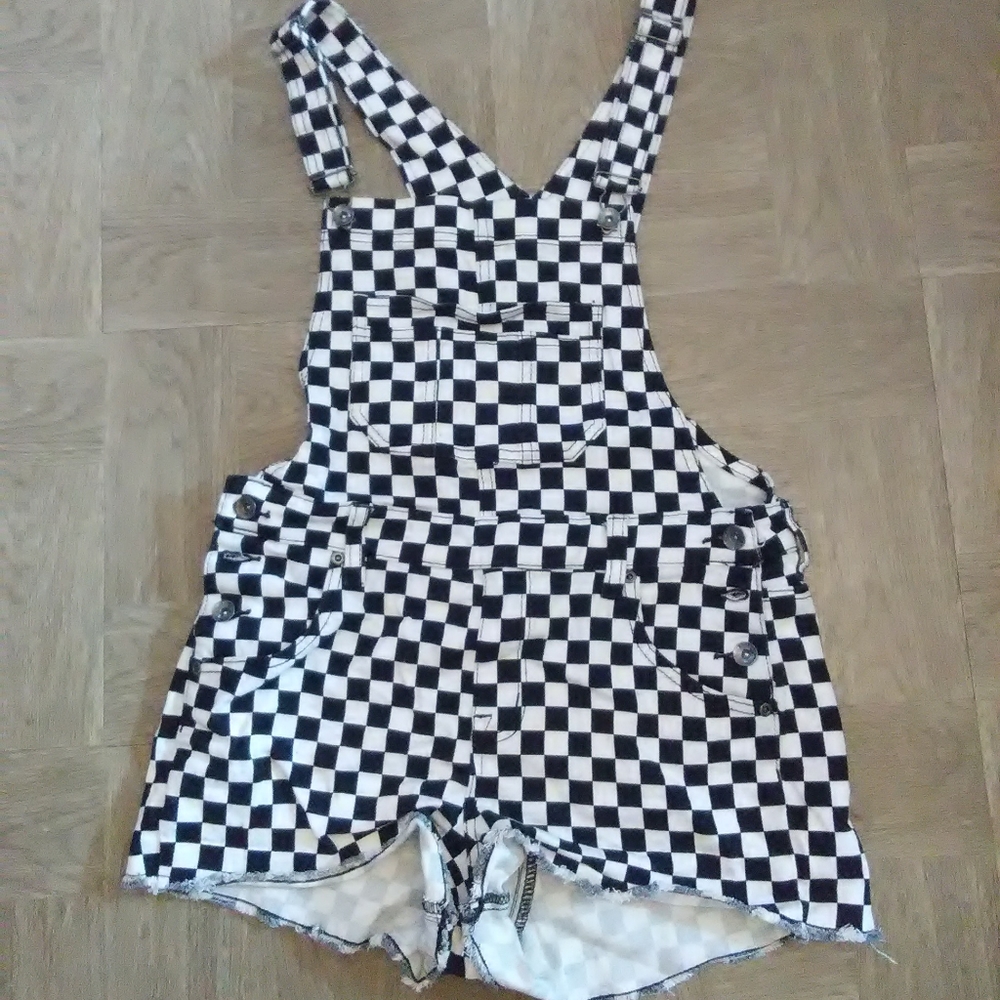 Checkered dungaree shorts.